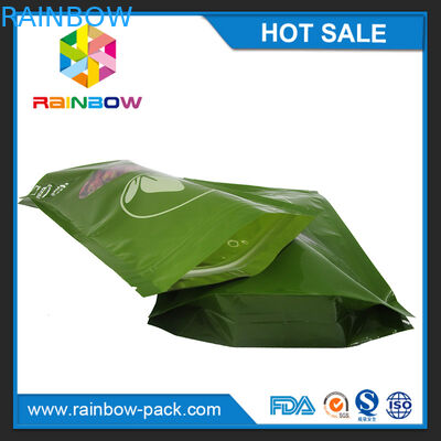 인쇄한 Mylar를 포장하는 녹색 티백은 명확한 창을 가진 지플락 부대를 위로 서 있습니다